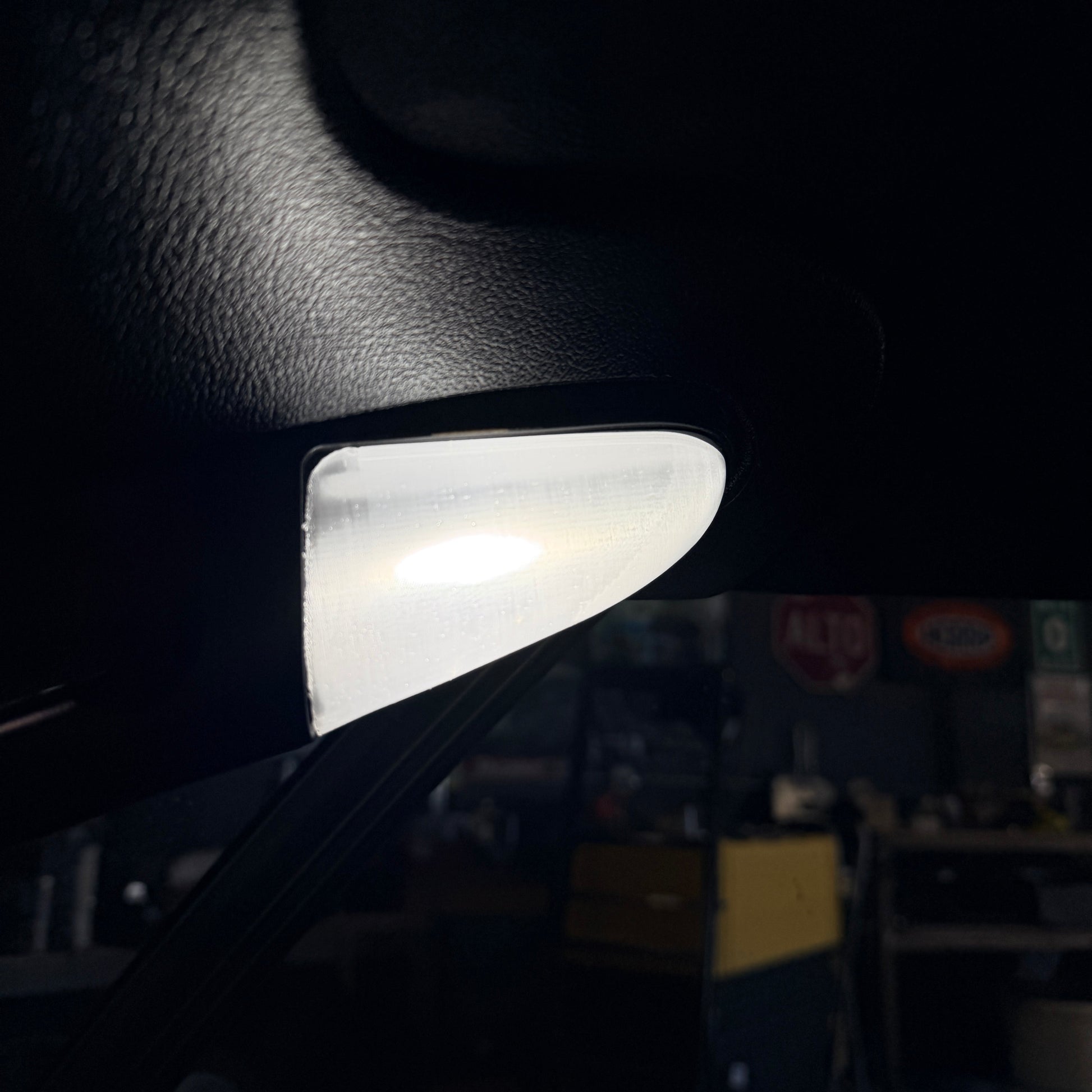 Small light source on a dark surface with a blurred background