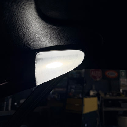 Small light source on a dark surface with a blurred background